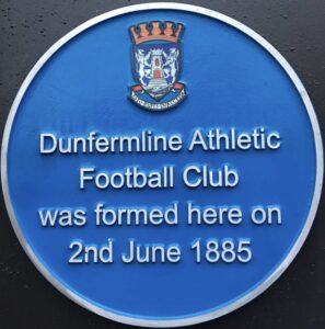 Blue plaque that says Dunfermline Athletic Football Club was formed her on 2 June 1885